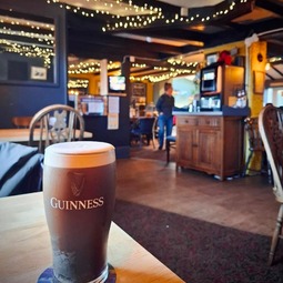 Pint beside the bar inside The Red Lion