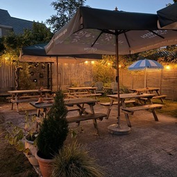 Beer garden illuminated at dusk