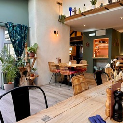 Bright dining room with wooden tables