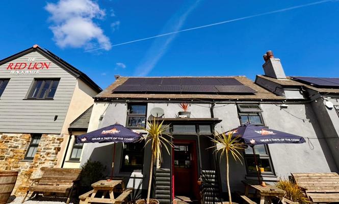 The Red Lion entrance with outdoor seating